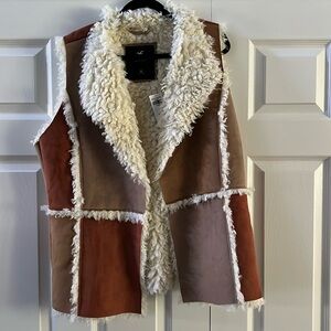 Fall into fall in this beautiful patchwork vest. New with tags size extra large.